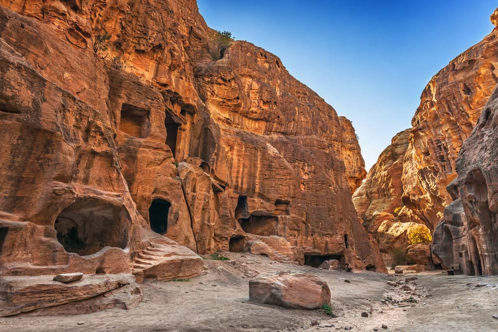 Cave dwellings the canyon Little Petra  Photo  Shutterstock