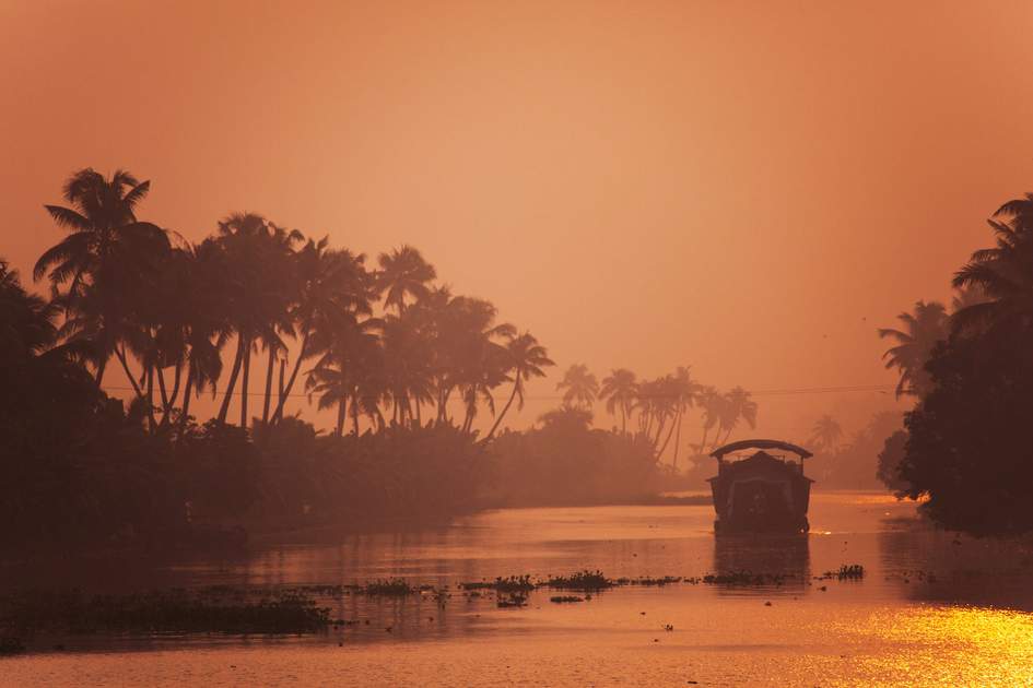 Tourist houseboat at sunset, Kerala