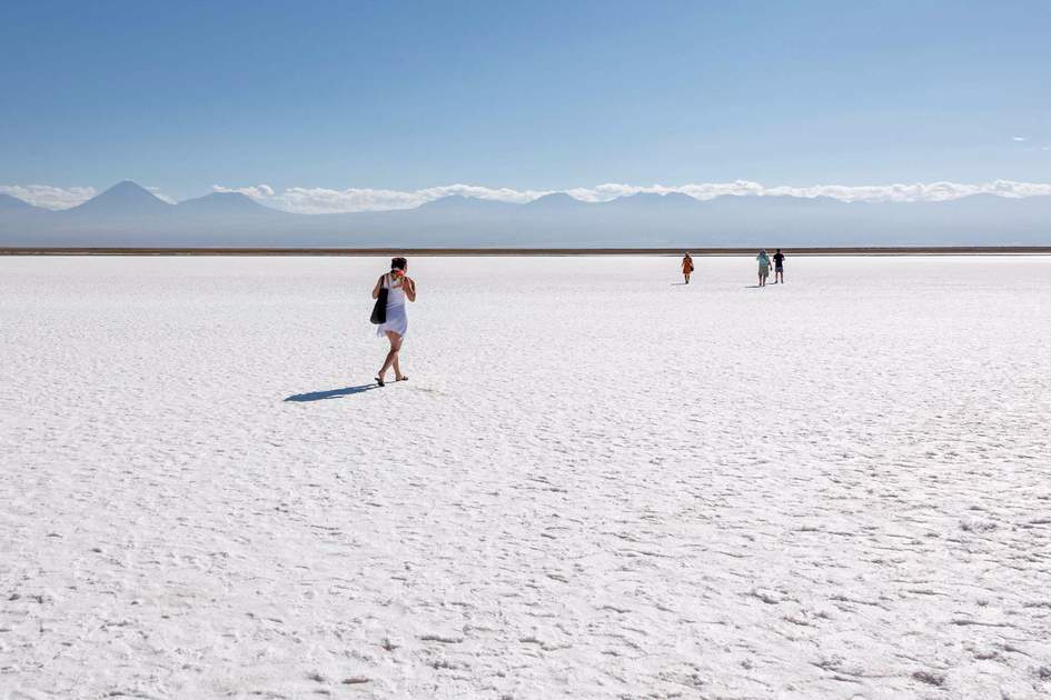 Tourists on the salt flats in the Atacama Desert 