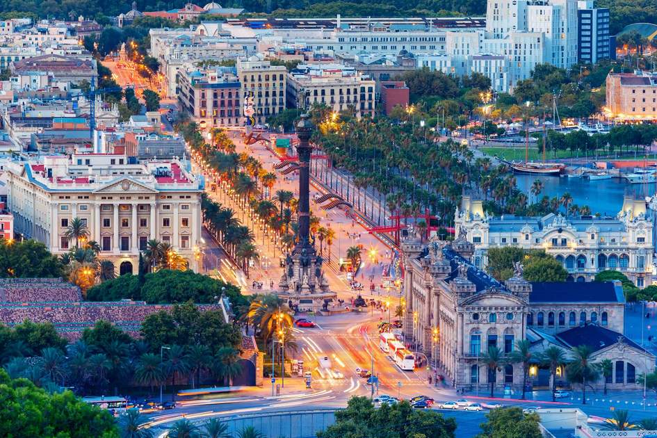 Aerial view over La Rambla with Columbus Monument at evening in Barcelona. Photo: Shutterstock