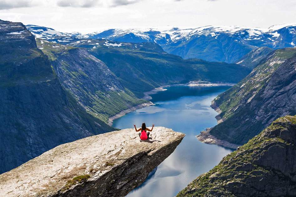 Norway's Trolltunga, one of the countless places you can fully appreciate when you travel solo. Photo: Shutterstock