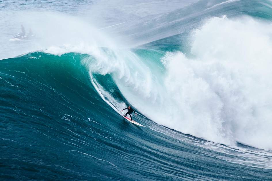 Surfing big waves in Nazaré, Portugal. Photo: tomasgehrhardt/Shutterstock